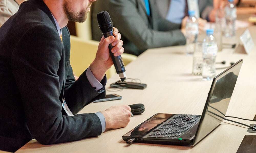speaker holding wireless microphone