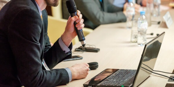 speaker holding wireless microphone